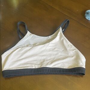 Lululemon pale pink and black w/mesh sports bra, size 10.